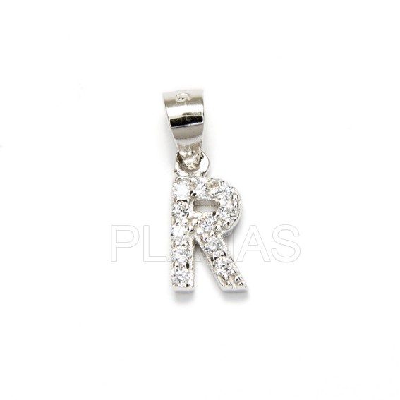 Letters in sterling silver and white zircons.