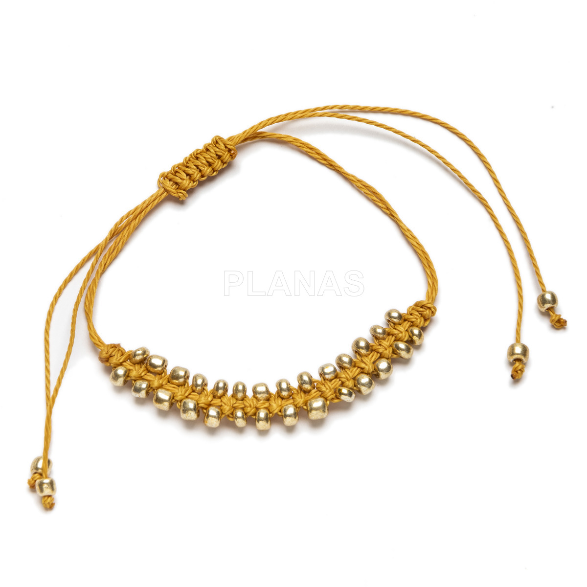 Pulsera con Nylón ajustable, cuentas de Rocalla dorada.