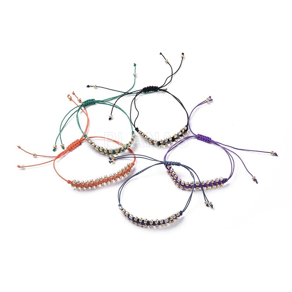 Pulsera con Nylón ajustable, cuentas de Rocalla dorada.