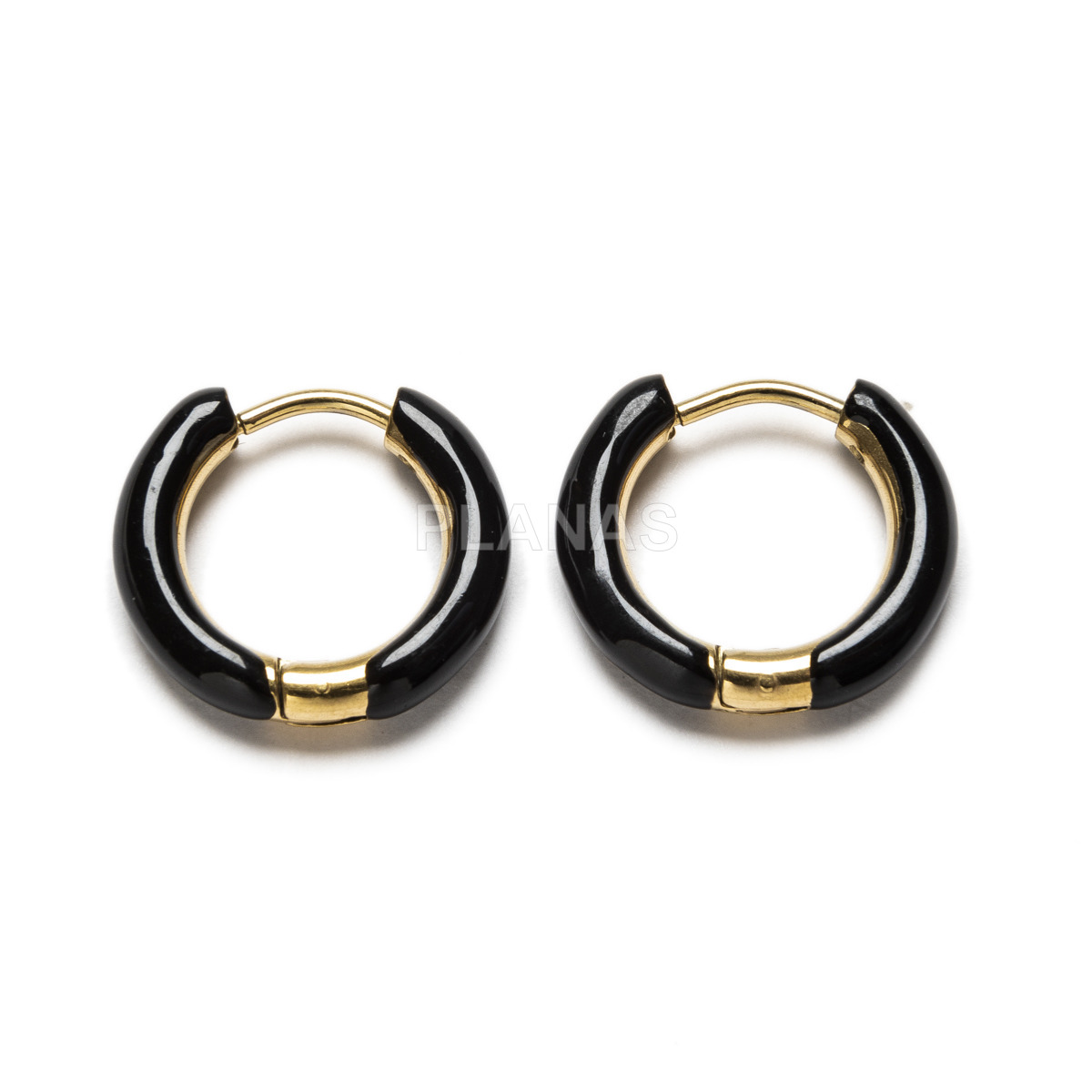 Rings in stainless steel and gold plated with black enamel.