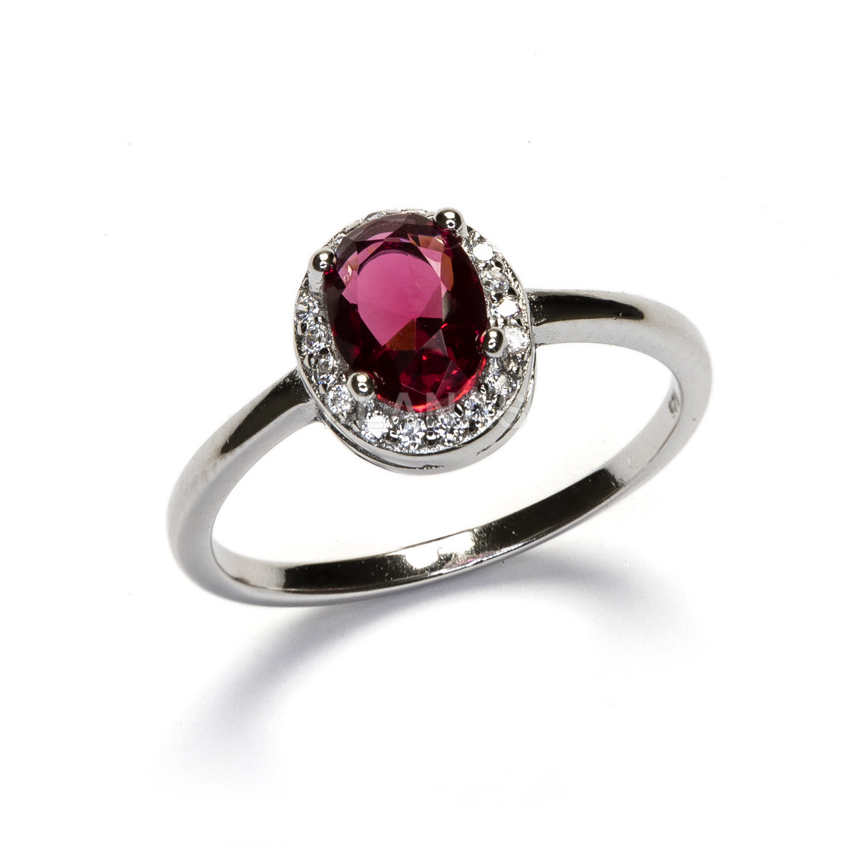 Ring in rhodium plated sterling silver and cubic zirconia in ruby.