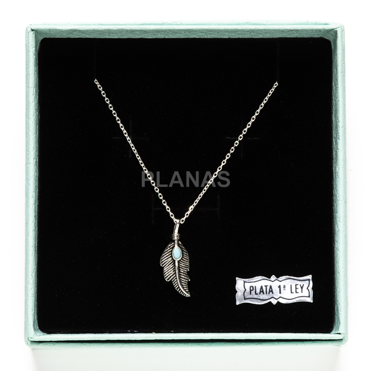 Colgante en Plata de Ley y Turquesa. PLUMA.