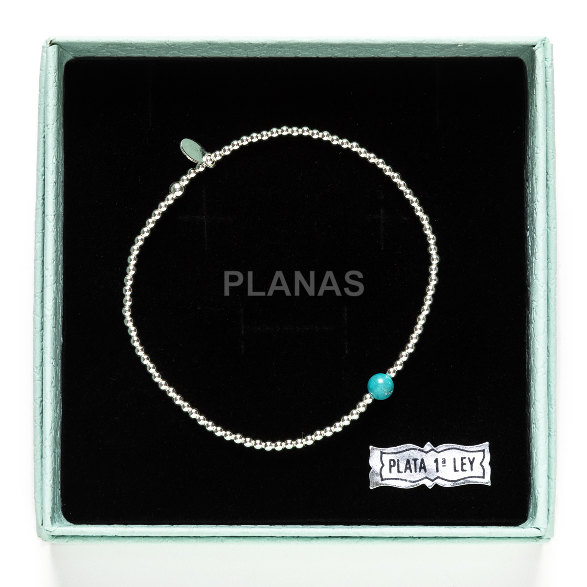 Pulsera elástica en Plata de Ley y bola Turquesa.  