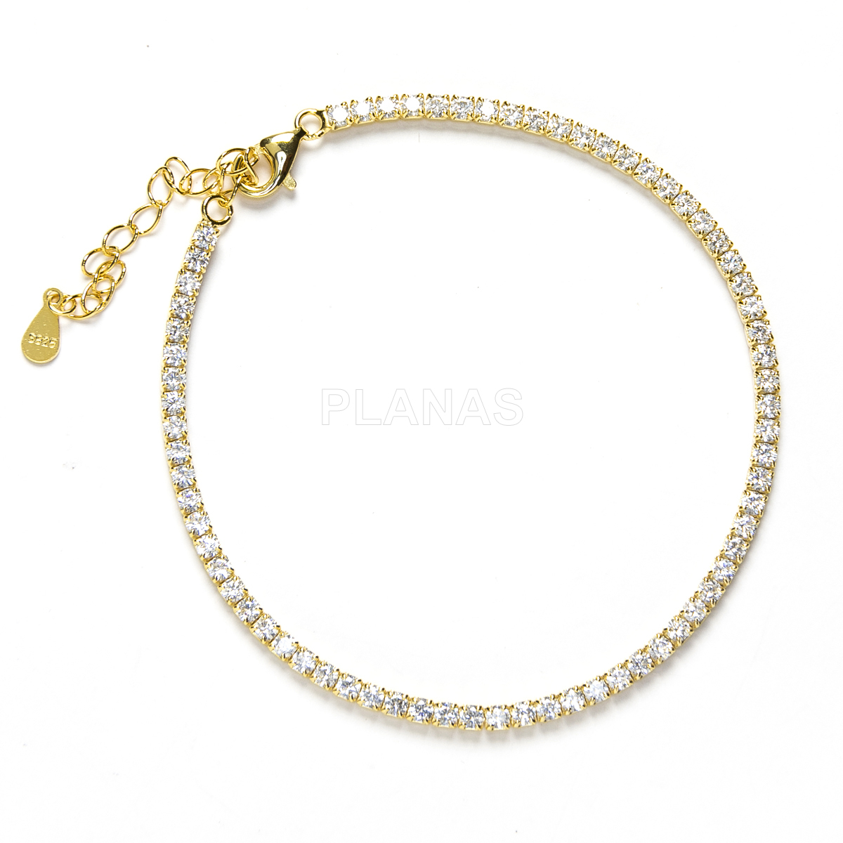 Pulsera en Plata de Ley y Baño oro con Circonitas Blancas. 