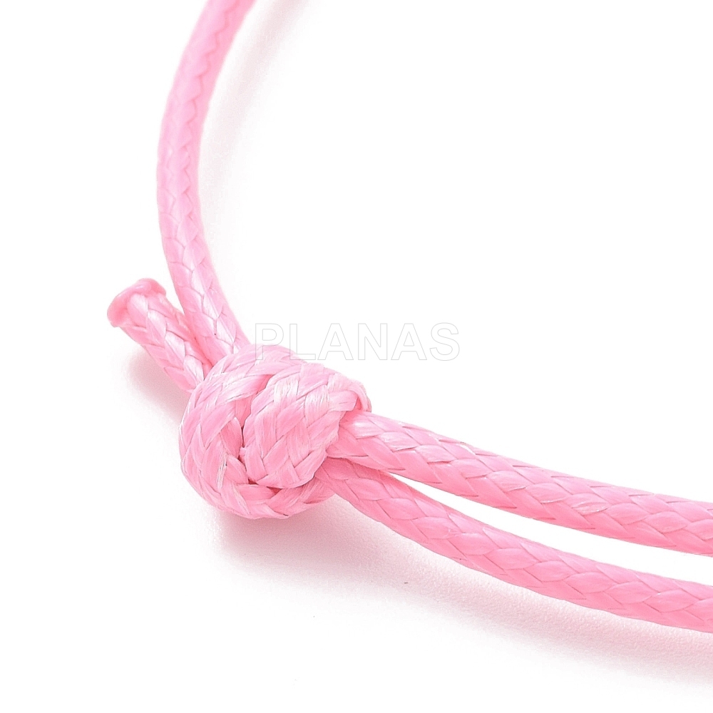 Pulseira com nó deslizante feita de fio encerado coreano, na cor rosa para montagem.