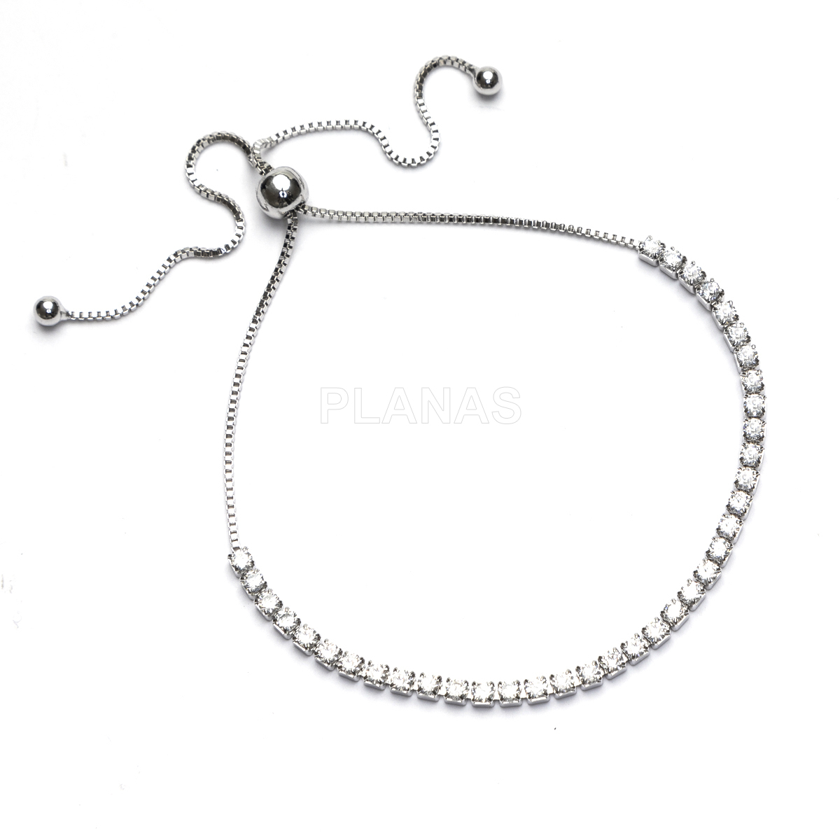 Pulseira de latão e zircônias cúbicas com nó deslizante.  