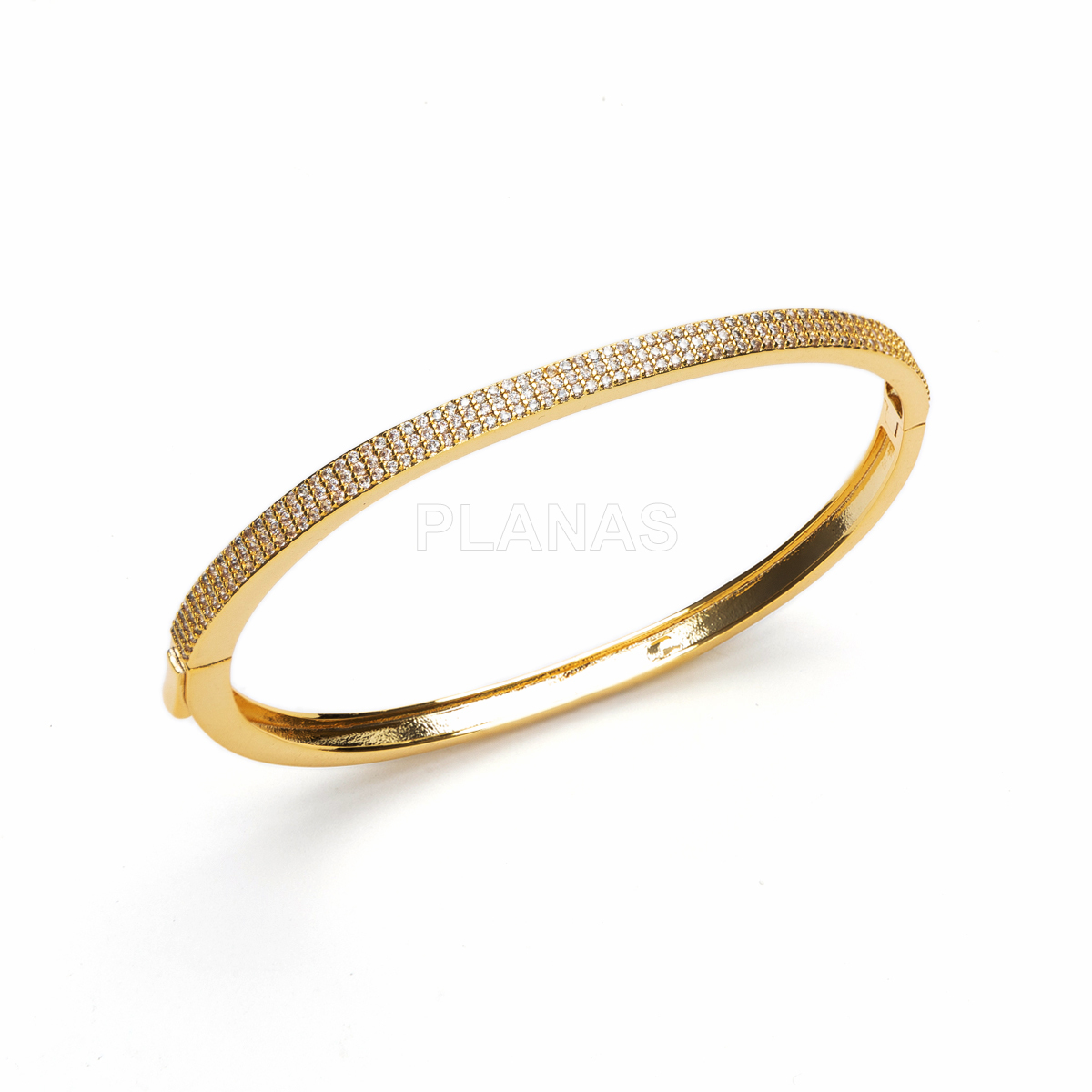 Pulsera rígida en latón con circonitas blancas.