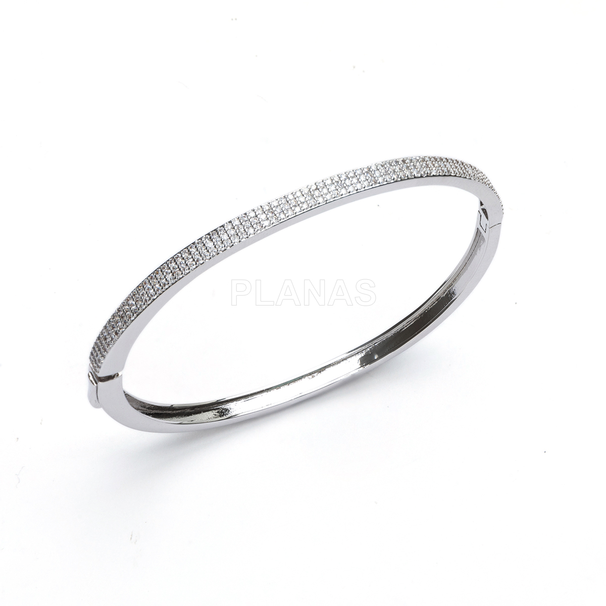 Pulsera rígida en latón con circonitas blancas.