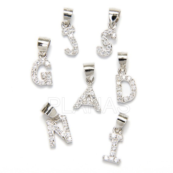Letters in sterling silver and white zircons.