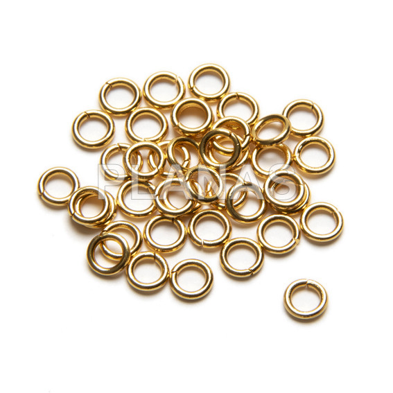 Rings in stainless steel and gold bath. 4x0,7mm. bags of 500 units.