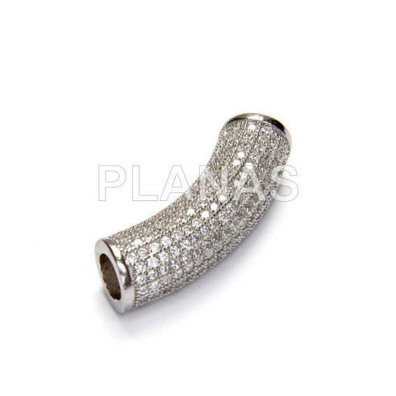 Rhodium-plated sterling silver and zircons. 23x7mm.