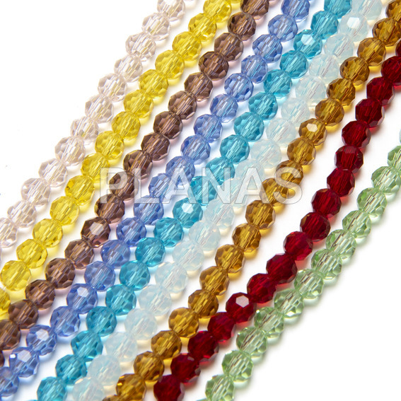 Balls in glass strips faceted 4mm.