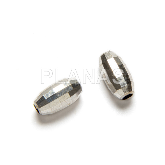 Oval faceted interpiece in sterling silver. 7x4mm.