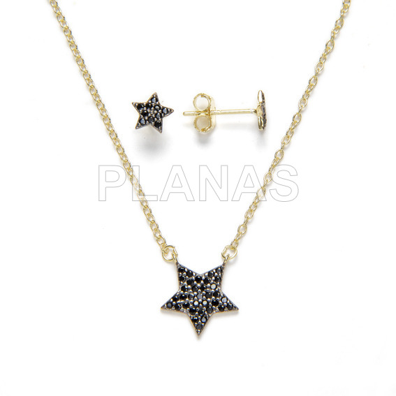 Set in sterling silver and gold bath with black zircons, earrings and pendant. star.
