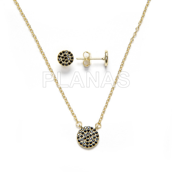 Set in sterling silver and gold bath with black zircons, earrings and pendant. circle.