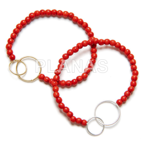 Elastic bracelet in sterling silver and coral double circle.