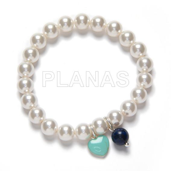 Elastic bracelet with 8mm swarovski pearls and sterling silver heart.
