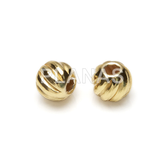 Striped ball in sterling silver and gold plating.