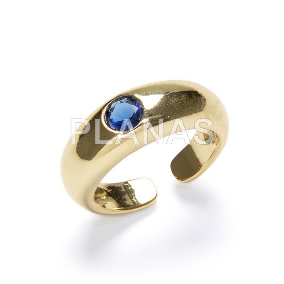 Open ring in brass and gold bath, sapphire color.
