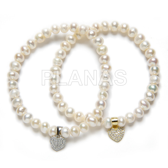 Elastic bracelet with 6mm cultured pearl and heart in sterling silver and zircons.