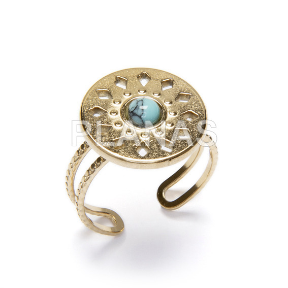 Ring in stainless steel and gold plated with natural stones.