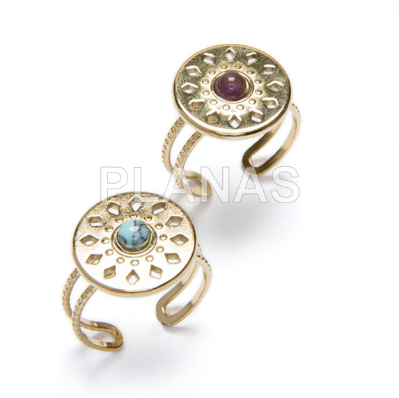 Ring in stainless steel and gold plated with natural stones.