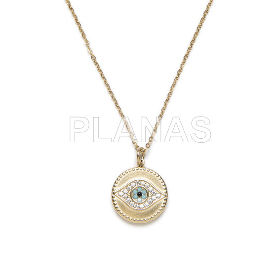 Pendant in stainless steel and gold plating with blue zircons. eye.