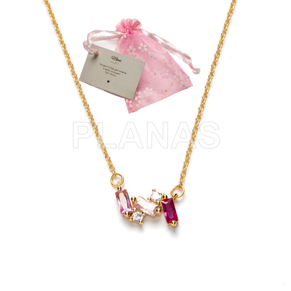 Pingente em banho de prata e ouro com zircônias rosa.