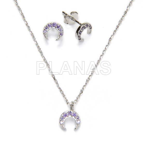 Set in rhodium-plated sterling silver and tanzanite zircons. inverted moon.