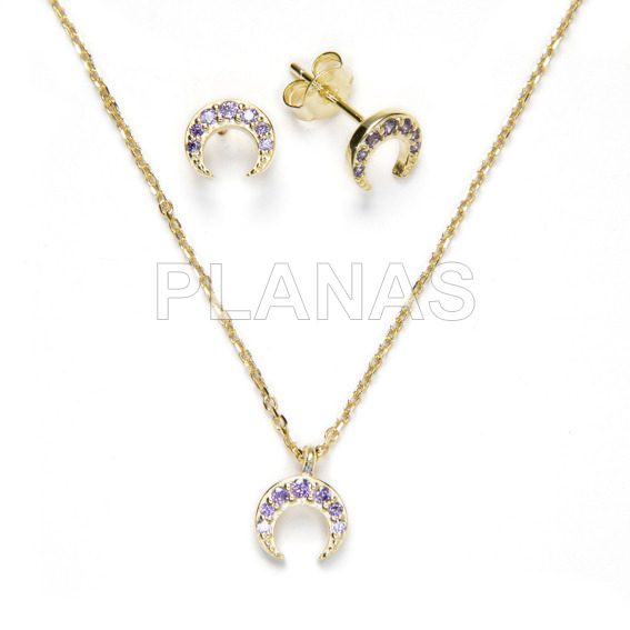 Set in sterling silver and gold bath with zircons tanzanite inverted moon.