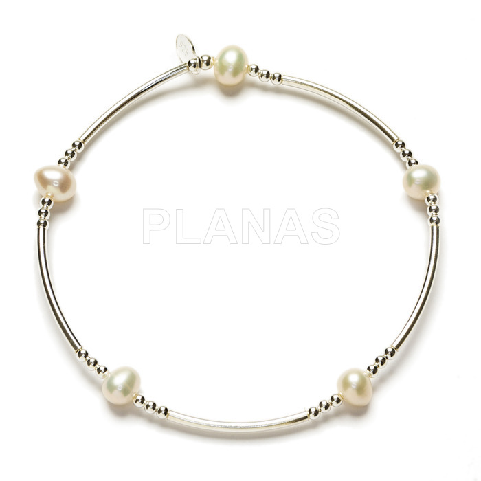 Elastic bracelet in sterling silver and cultured pearls.
