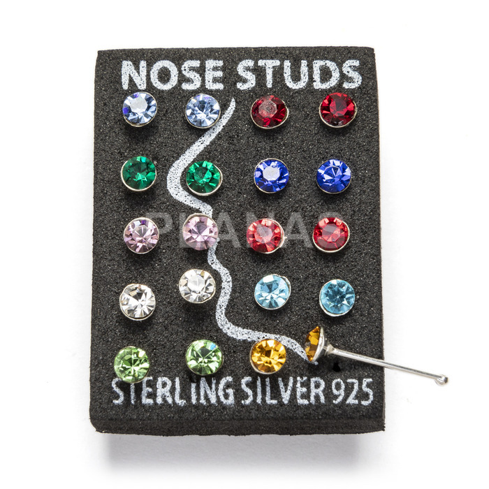 Nose piercing in sterling silver, 2.2mm colored zircons.