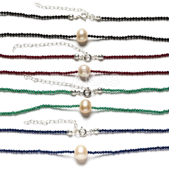 Necklace in sterling silver and first quality crystal with cream cultured pearl.