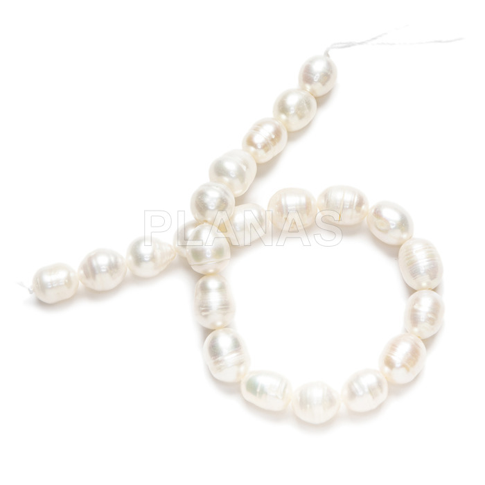 String of irregular cultured pearls. 7mm approx.