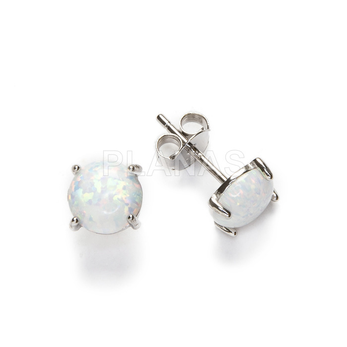 Rhodium plated sterling silver and opal earrings.