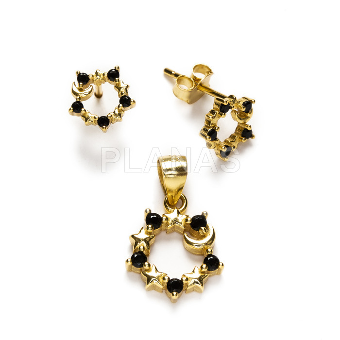Set in sterling silver and gold plated with black zircons, earrings and pendant.