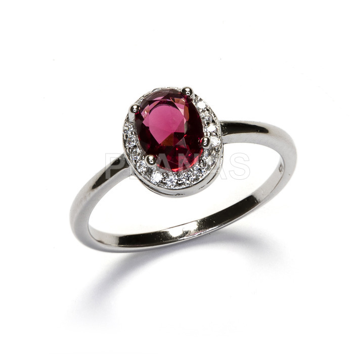 Ring in rhodium plated sterling silver and cubic zirconia in ruby.