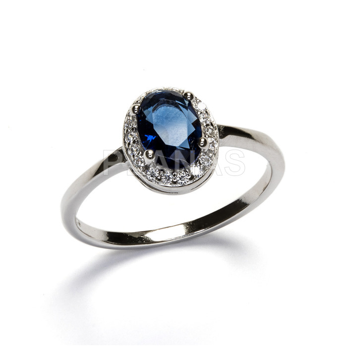 Ring in rhodium plated sterling silver and zirconia in sapphire.