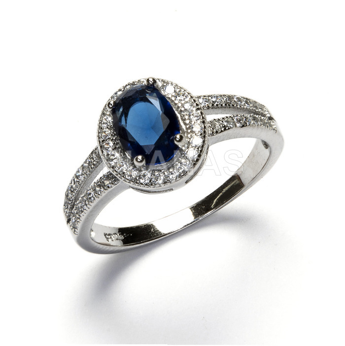 Ring in rhodium plated sterling silver and blue zircons.
