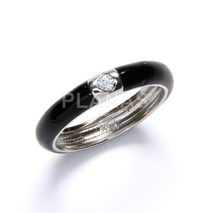 Rhodium plated sterling silver ring with zirconia and black enamel.