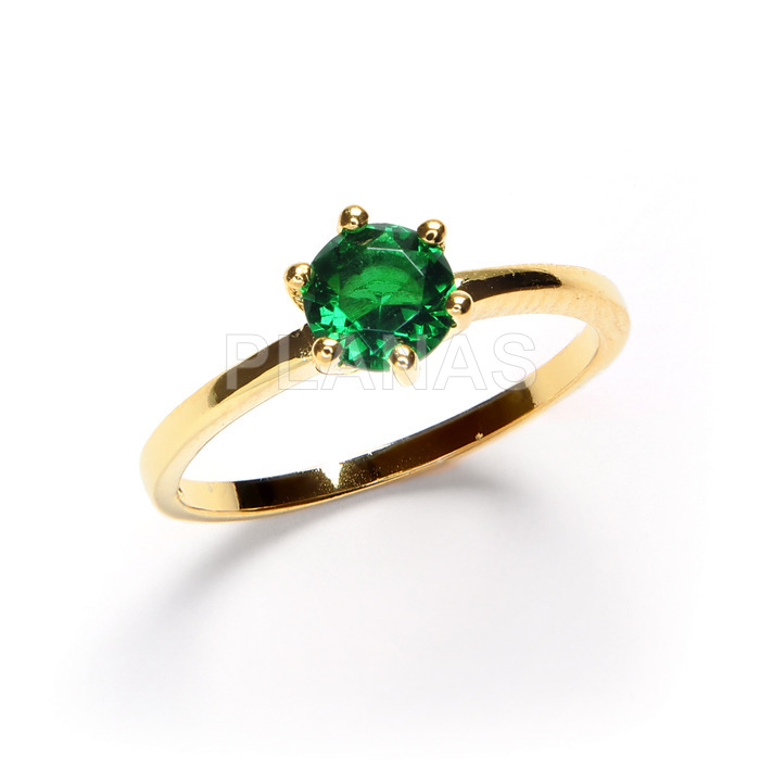 One micron gold plated sterling silver ring with green zirconia.