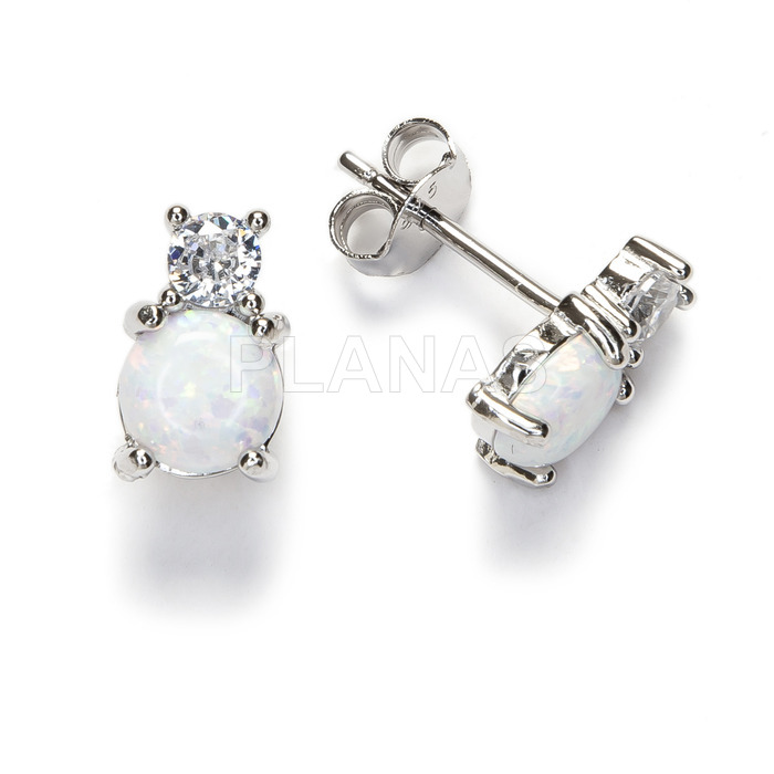 Rhodium-plated sterling silver and opal earrings.
