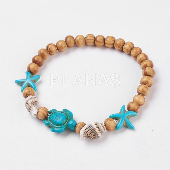 Elastic bracelet in wood and synthetic turquoise. turtle and sea star.