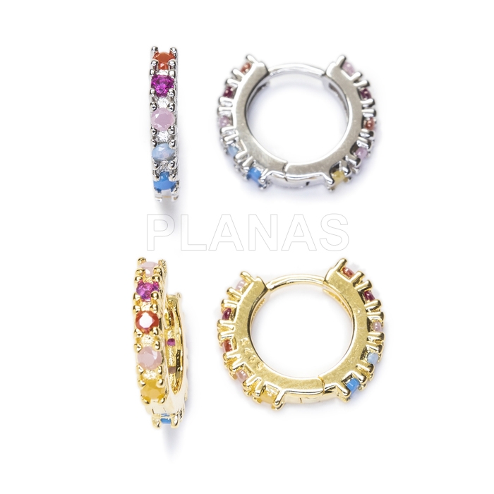 Hoops in rhodium plated sterling silver and colored zircons.