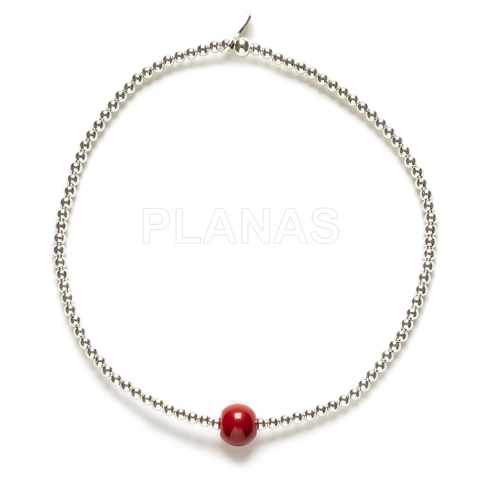 Elastic bracelet in sterling silver and coral.
