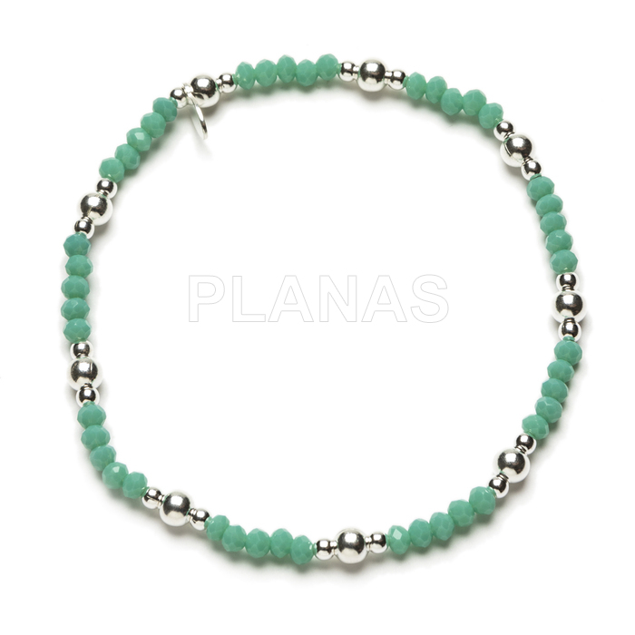 Elastic bracelet with sterling silver balls and pool green pebbles.