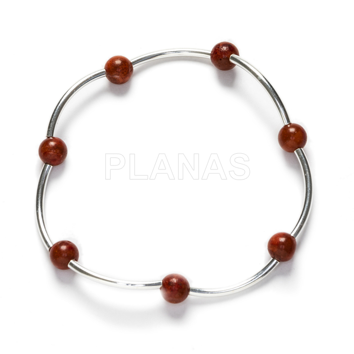 Elastic bracelet in sterling silver with 6mm coral balls.