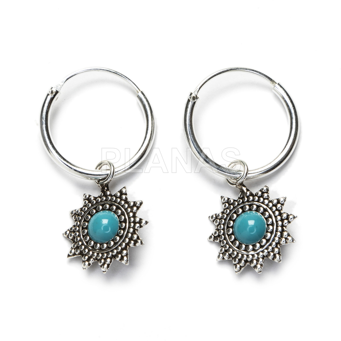 Earrings in sterling silver and reconstituted turquoise.