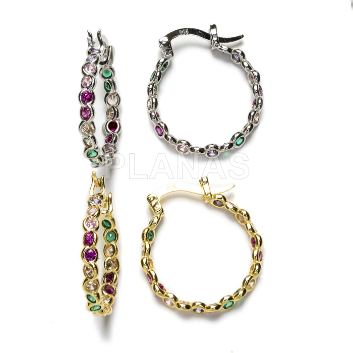 Hoops in rhodium-plated sterling silver and colored zircons.