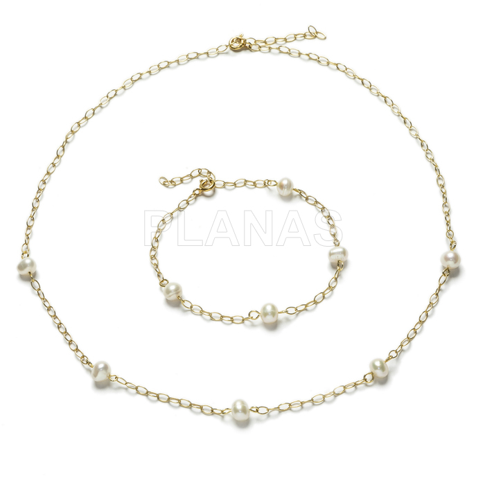 Adjustable necklace and bracelet set in sterling silver and gold plated with cultured pearls.